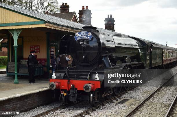 The Flying Scotsman steam locomotive waits at Horsted Keynes railway station, a preserved station on the Bluebell Railway Line in East Sussex,...