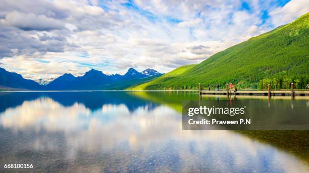 reflections in lake mcdonald - mcdonald creek stock-fotos und bilder