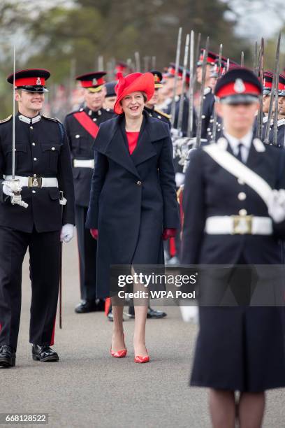 British Prime Minister Theresa May inspects the Officer Cadets during the Sovereign's Parade at Royal Military Academy Sandhurst on April 13, 2017 in...