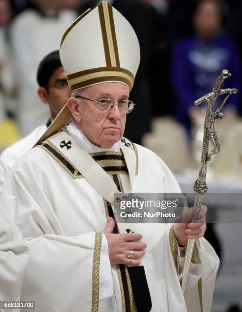 Pope Francis leaves at the end of the Chrism Mass for Holy Thursday which marks the start of Easter celebrations in St. Peter's Basilica in Vatican...