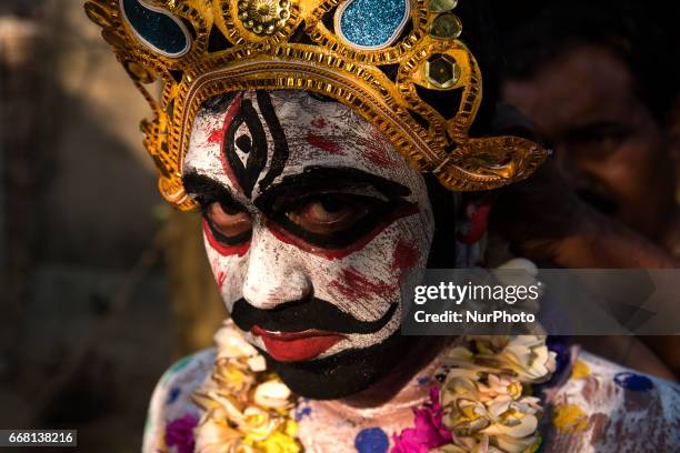 Performer has dressed himself up as a cosmetic deity, locally known as &quot;soung of gajan&quot; in Burdwan, India on 13 April 2017....