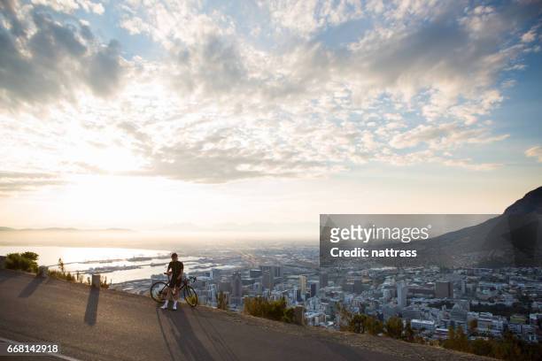 quick cup of coffee on my training ride - cape peninsula stock pictures, royalty-free photos & images