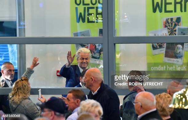 Dutch politician and leader of the far right party, Party for Freedom , Geert Wilders waves during his visit to the municipality Rucphen on April 13,...