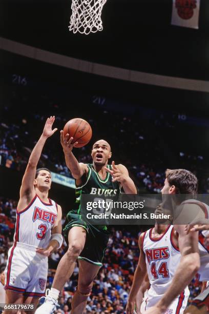 Blue Edwards of the Milwaukee Bucks shoots against the New Jersey Nets during a game played circa 1993 at the Brendan Byrne Arena in East Rutherford,...