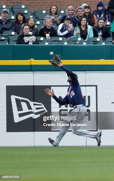 Center fielder Byron Buxton of the Minnesota Twins catches a fly ball hit by Tyler Collins of the Detroit Tigers for an out during the fourth inning...