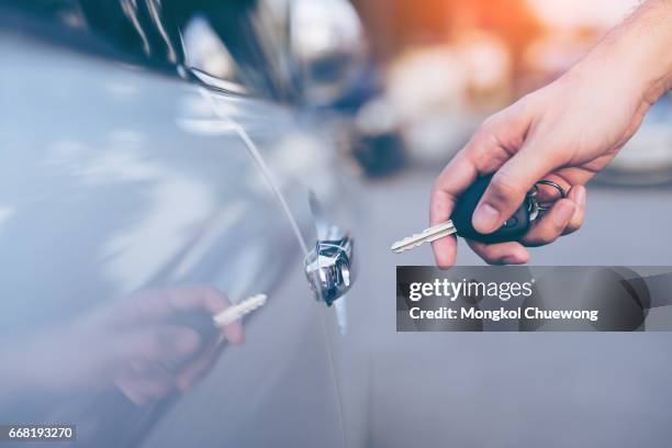 business car concept - car keys hand stockfoto's en -beelden