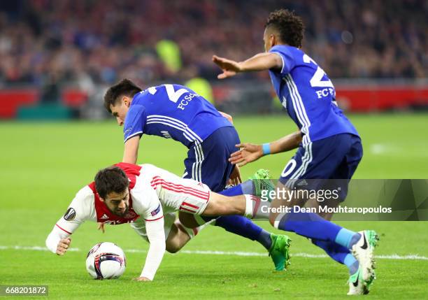 Amin Younes of Ajax is fouled by Alessandro Schopf of FC Schalke 04 leading to a penalty scored by Davy Klaassen during the UEFA Europa League...