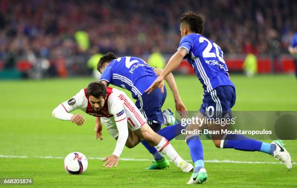 Amin Younes of Ajax is fouled by Alessandro Schopf of FC Schalke 04 leading to a penalty scored by Davy Klaassen during the UEFA Europa League...