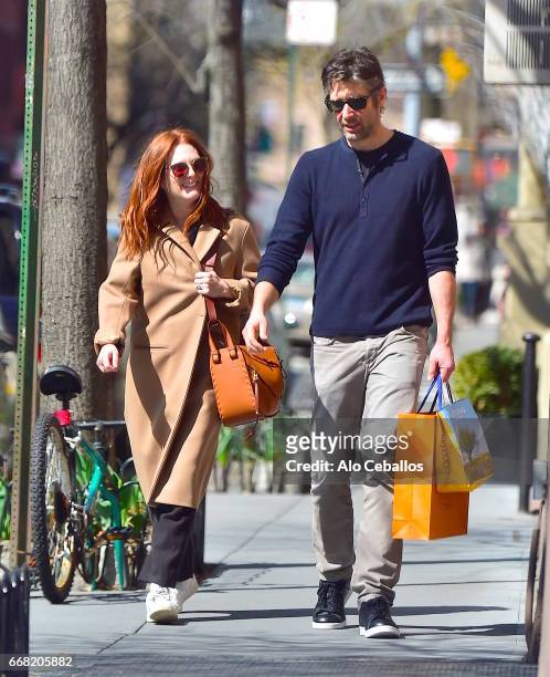 Julianne Moore and Bart Freundlich are seen in the West Village on April 13, 2017 in New York City.
