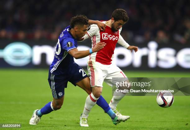 Amin Younes of Ajax and Thilo Kehrer of FC Schalke 04 in action during the UEFA Europa League quarter final first leg match between Ajax Amsterdam...