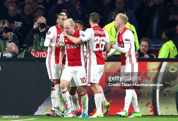 Davy Klaassen of Ajax celebrates with team mates after he scores his and his sides second goal during the UEFA Europa League quarter final first leg...