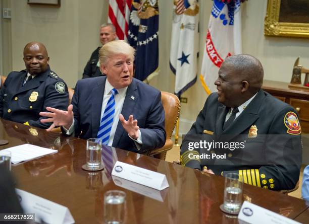 President Donald Trump meets with the Atlanta, Georgia I-85 bridge first responders in the Roosevelt Room of the White House in Washington, DC on...