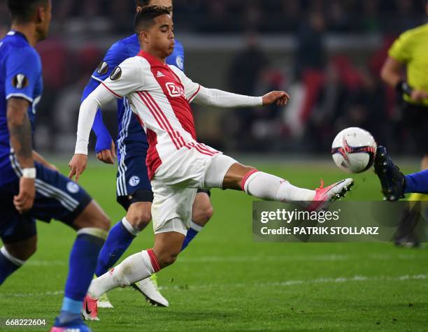 Ajax Amsterdam's Dutch striker Justin Kluivert controls the ball during the UEFA Europa League football match between Ajax Amsterdam and Schalke 04...