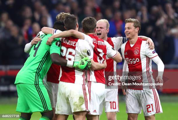 Ajax celebrate after the full time whistle in the UEFA Europa League quarter final first leg match between Ajax Amsterdam and FC Schalke 04 at...