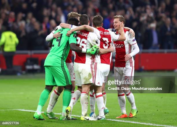 Ajax celebrate after the full time whistle in the UEFA Europa League quarter final first leg match between Ajax Amsterdam and FC Schalke 04 at...