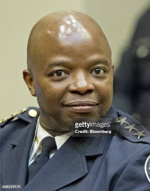 Rodney Bryant, assistant chief of the Atlanta Police Department, waits for the arrival of U.S. President Donald Trump, not pictured, during a meeting...