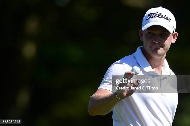 Bud Cauley reacts after his birdie putt on the 17th green during the first round of the 2017 RBC Heritage at Harbour Town Golf Links on April 13,...