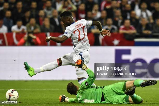 Lyon's French forward Maxwel Cornet vies with Besiktas' Spanish goalkeeper Fabricio Agosto Ramirez during the UEFA Europa League first leg quarter...