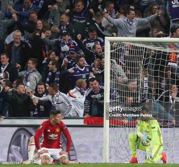 Marcos Rojo and Sergio Romero of Manchester United react to conceding a late goal during the UEFA Europa League quarter final first leg match between...