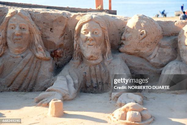 Sculpture made of sand shows Jesus Christ's Last Supper, as conceived by Paraguayan artist Oscar Garcete, during the Holy Week celebrations, in...