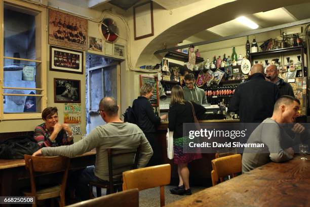 At the start of the evening only a few regulars can be found at the Osteria Del Sole bar on March 30, 2017 in Bologna, Italy, in just a few hours...