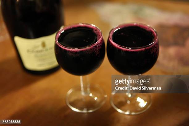 Glasses are filled to the brim with Medici Ermete Concerto Lambrusco Reggiano, a local ruby red sparkling wine made with Lambrusco Salamino grapes,...