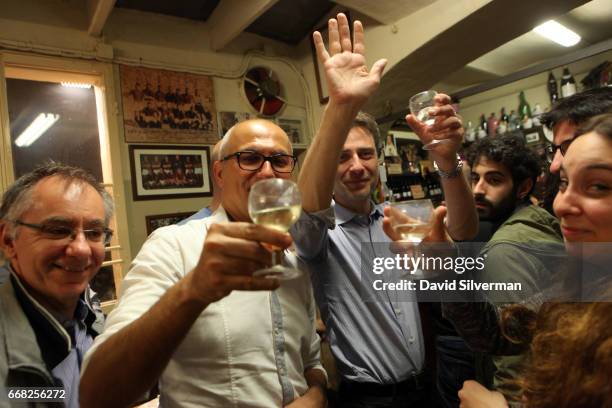 Italian businessmen enjoy a night out together the Osteria Del Sole bar on March 30, 2017 in Bologna, Italy. Situated on Via Ranocchi, an alleyway in...