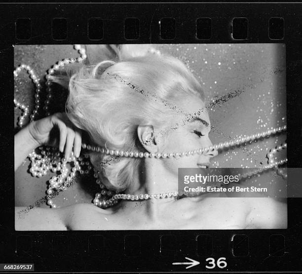 American actress Marilyn Monroe draped in pearls, Beverly Hills, California, June 1962. The two sessions for the photoshoot took place in late June...