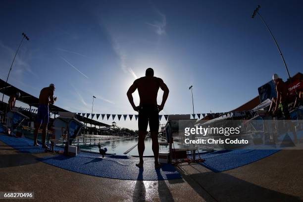 Nathan Adrian waits for the start of the final of the 100 meter freestyle on day one of the Arena Pro Swim Series - Mesa at Skyline Aquatic Center on...