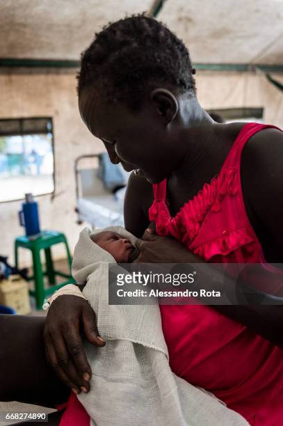 South-Sudan, Mingkaman in Lake State. UNFPA facility with pregnant mother on labour. The facility is deliviring an avarage of 15 babies per week. The...