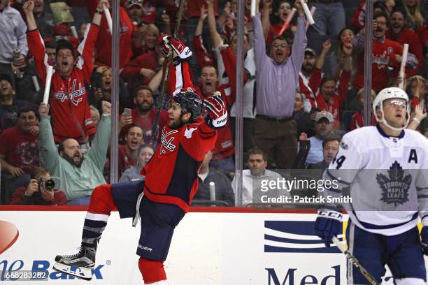 Tom Wilson of the Washington Capitals celebrates after scoring the game-winning goal against the Toronto Maple Leafs in overtime in Game One of the...
