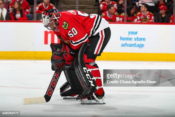 Goalie Corey Crawford of the Chicago Blackhawks waits for play to begin in the third period against the Nashville Predators in Game One of the...