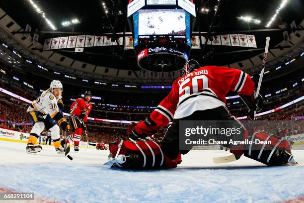 Viktor Arvidsson of the Nashville Predators scores the game-winning goal on goalie Corey Crawford of the Chicago Blackhawks in the first period in...