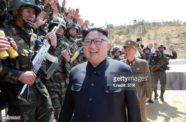 This undated picture released from North Korea's official Korean Central News Agency on April 14, 2017 shows North Korean leader Kim Jong-Un...