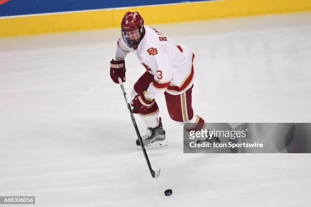 Denver Pioneers defenseman Tariq Hammond controls the puck in the first period of an NCAA Frozen Four semifinal game with the Denver Pioneers and the...