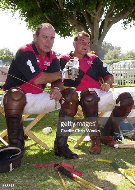 Actor Tommy Lee Jones, left, and his San Saba polo teammate Luis Echezarreta share a drink between "chukkers" July 16, 2000 at the Santa Barbara Polo...