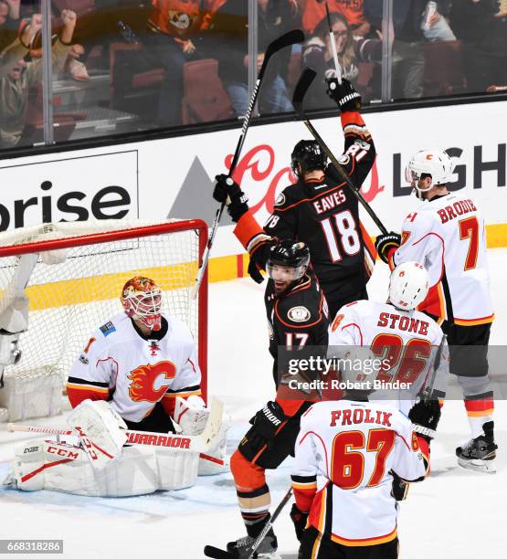 Ryan Kesler and Patrick Eaves of the Anaheim Ducks celebrate a second period goal against Brian Elliott, Michael Frolik, Michael Stone, and T.J....