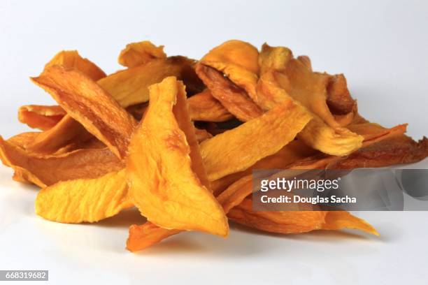 close-up of dried mango chips (mangifera indica) - dried food stock pictures, royalty-free photos & images