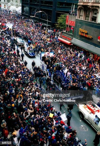 New York Yankee fans cheer October 30, 2000 during the Yankees'' victory parade in New York City. The Yankees defeated the New York Mets...