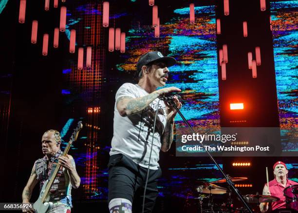 The Red Hot Chili Peppers perform at the Verizon Center Wednesday night. Pictured: Flea , Anthony Kiedis, Chad Smith.