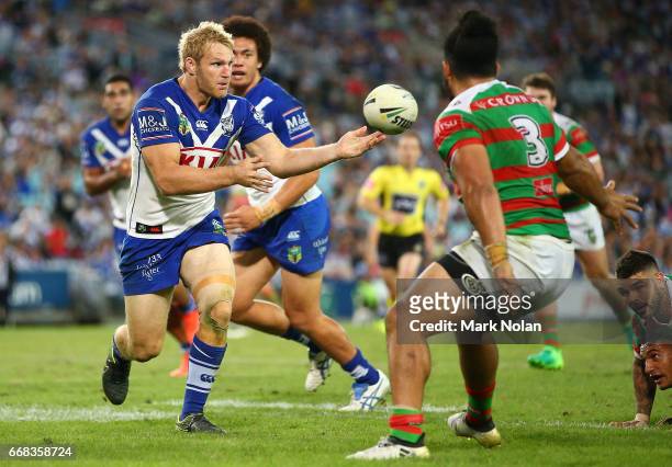 Aiden Tolman of the Bulldogs offloads during the round seven NRL match between the Canterbury Bulldogs and the South Sydney Rabbitohs at ANZ Stadium...