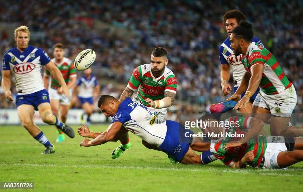 Marcelo Montoya of the Bulldogs offloads to st up a try during the round seven NRL match between the Canterbury Bulldogs and the South Sydney...