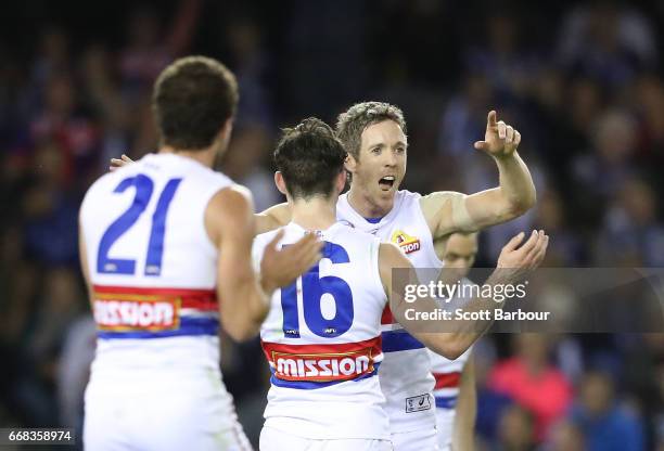 Robert Murphy of the Bulldogs celebrates after kicking a goal during the round four AFL match between the North Melbourne Kangaroos and the Western...