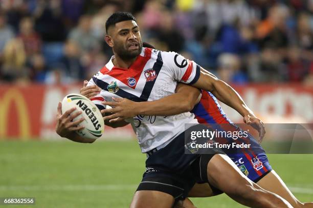 Daniel Tupou of the Roosters is tackled during the round seven NRL match between the Newcastle Knights and the Sydney Roosters at McDonald Jones...