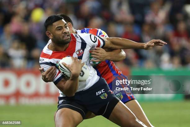 Daniel Tupou of the Roosters is tackled during the round seven NRL match between the Newcastle Knights and the Sydney Roosters at McDonald Jones...