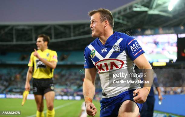 Josh Morris of the Bulldogs celebrates scoring a try during the round seven NRL match between the Canterbury Bulldogs and the South Sydney Rabbitohs...