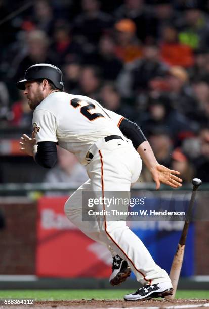 Conor Gillaspie of the San Francisco Giants hits an rbi single scoring Brandon Belt against the Arizona Diamondbacks in the bottom of the fifth...