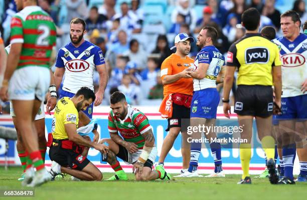 Adam Reynolds of the Rabbitohs and Josh Reynolds of the Bulldogs recieve attention for injuries during the round seven NRL match between the...