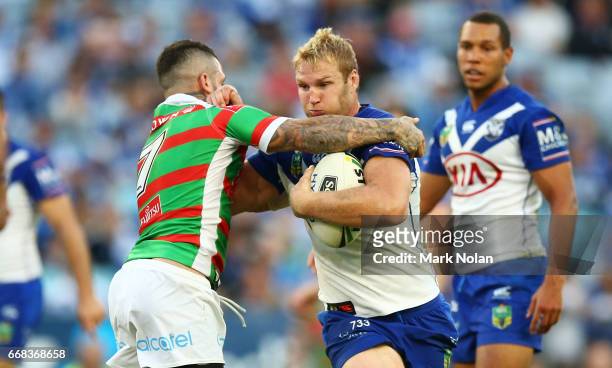 Aiden Tolman of the Bulldogs is tackled during the round seven NRL match between the Canterbury Bulldogs and the South Sydney Rabbitohs at ANZ...