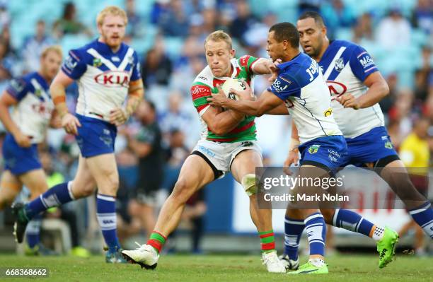 Jason Clark of the Rabbitohs is tackled during the round seven NRL match between the Canterbury Bulldogs and the South Sydney Rabbitohs at ANZ...
